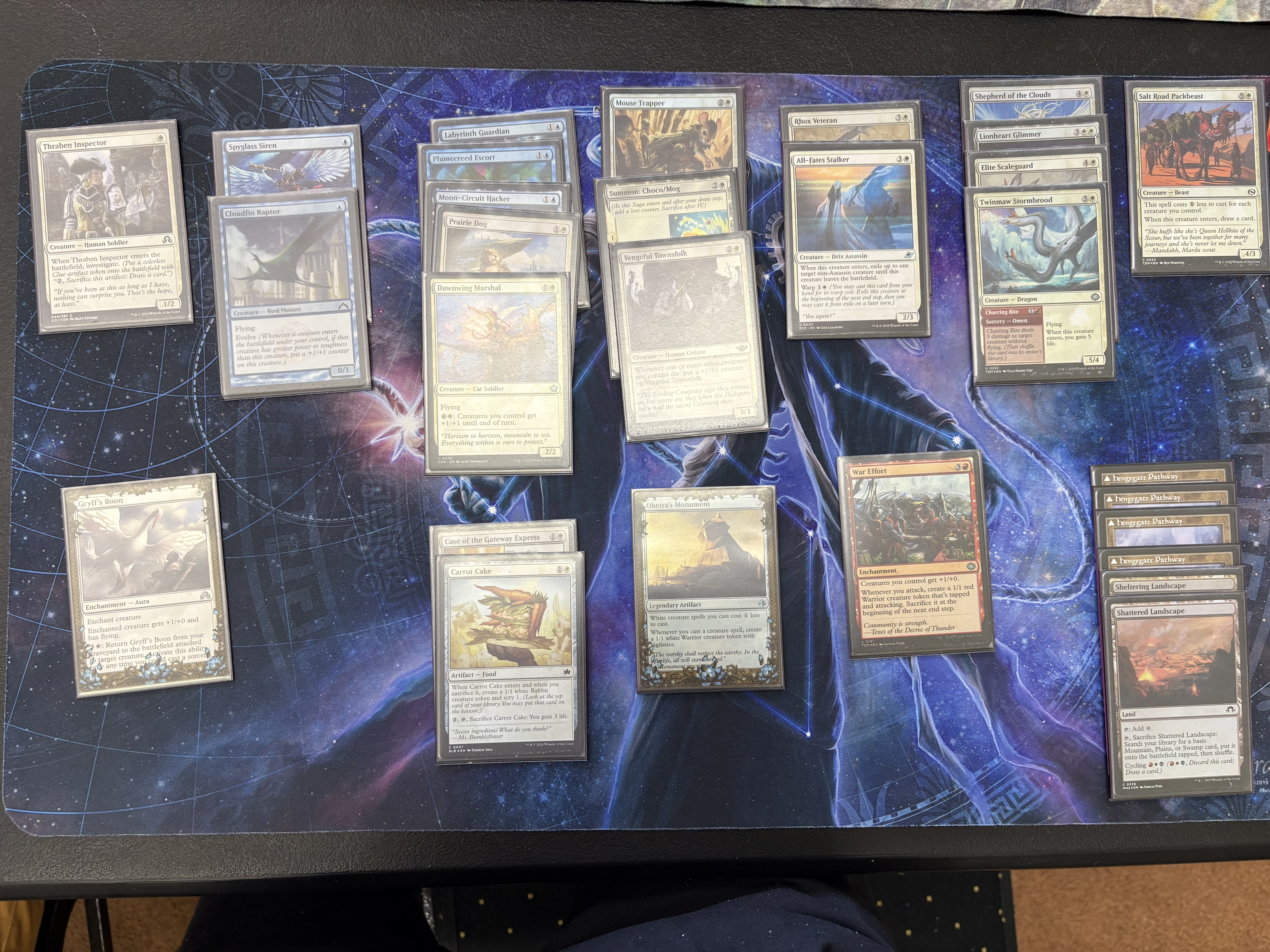 A deck picture of an Azorius splashing red go-wide deck.